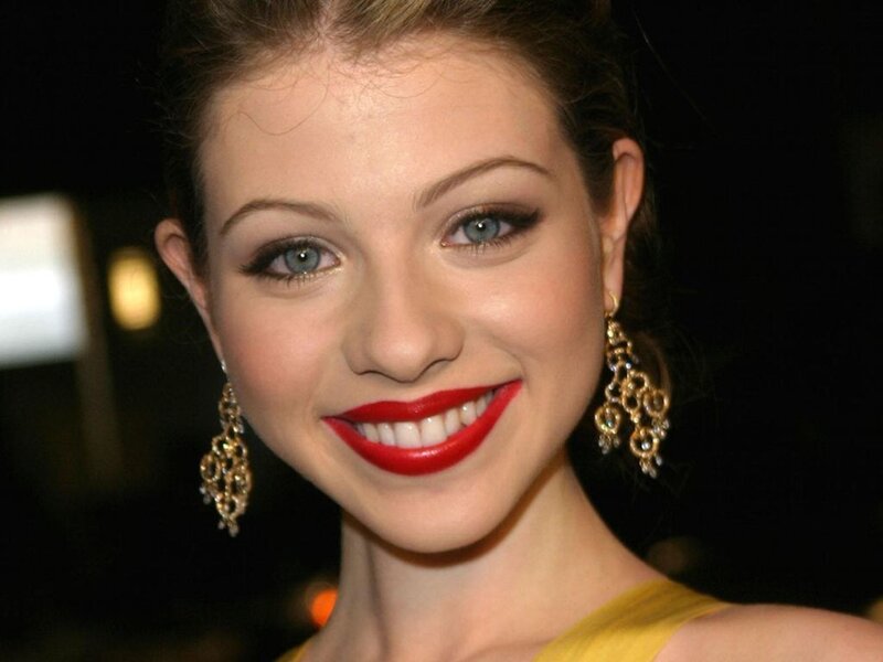 woman with red lipstick smiling