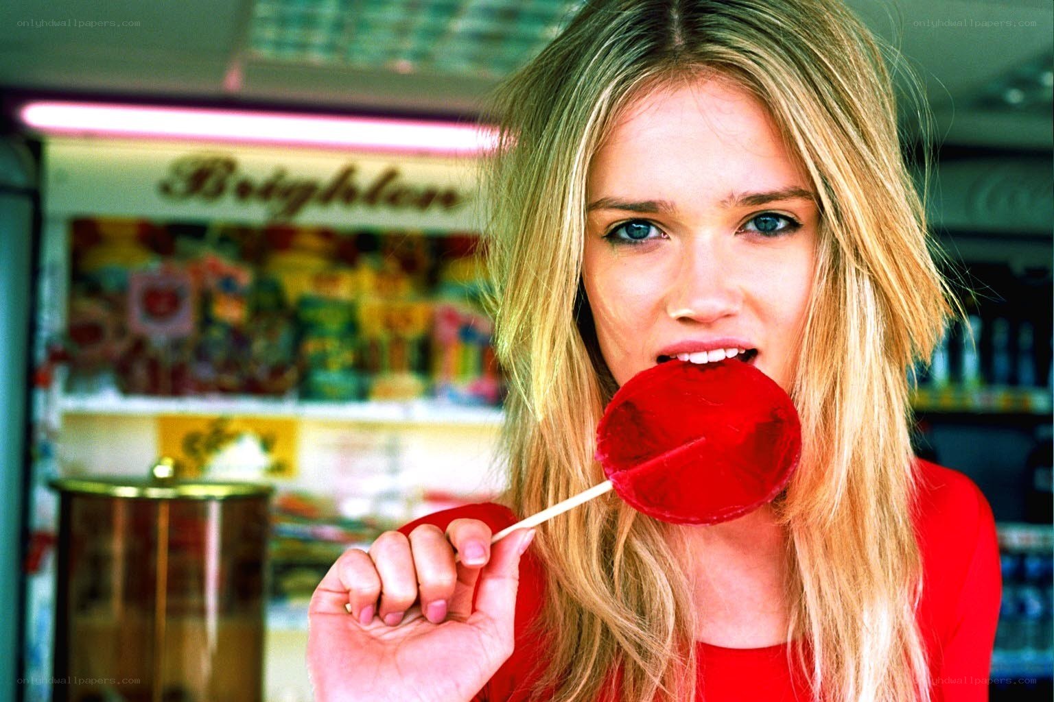 Woman with red lollipop