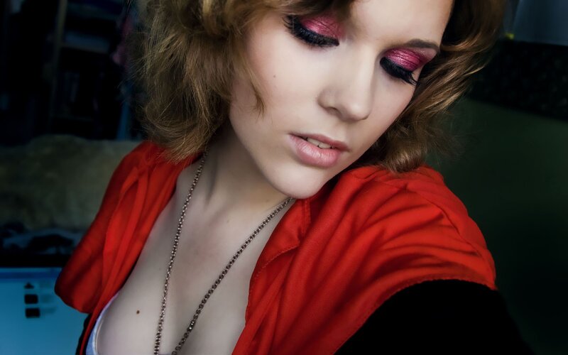 woman with red makeup and clothing