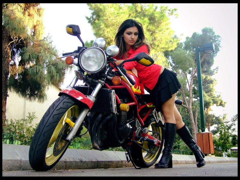 Woman with red motorcycle