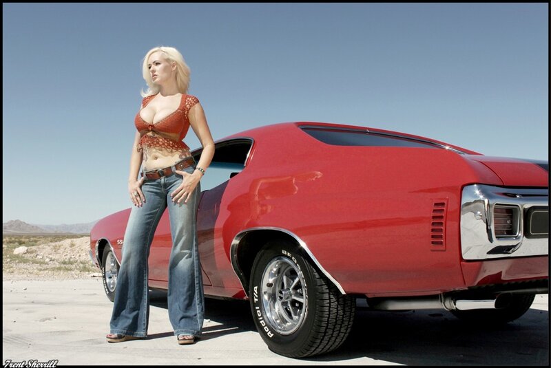 Woman with red muscle car