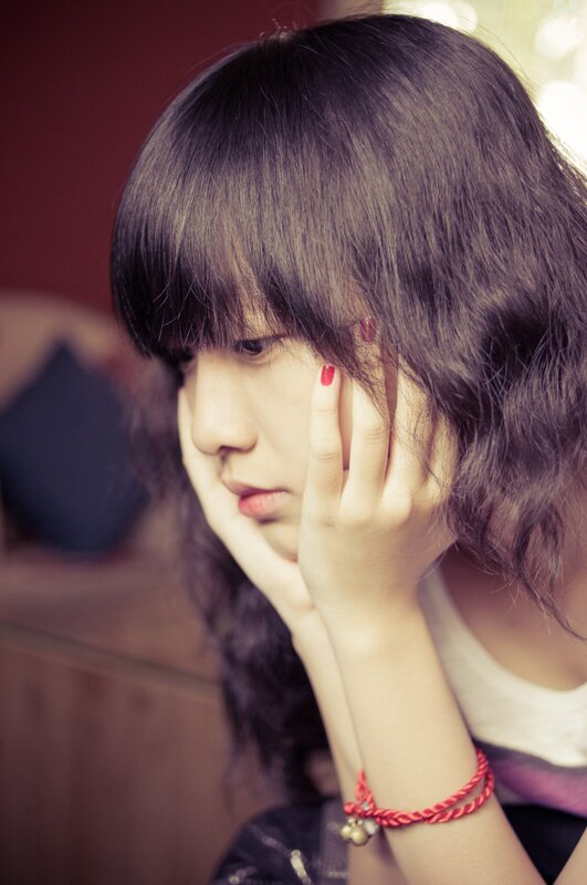 woman with red nail polish