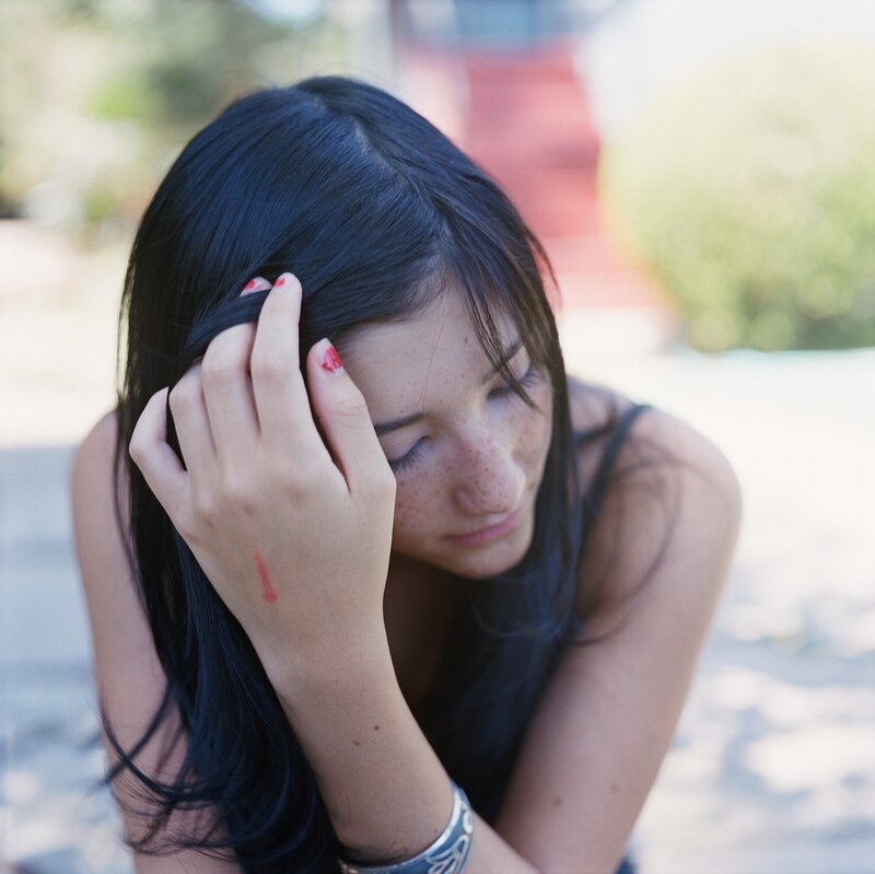 woman with red nail polish