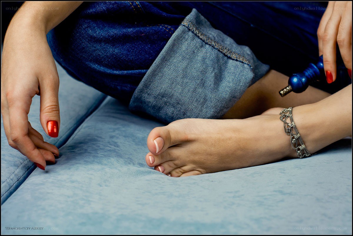 woman with red nails and anklet
