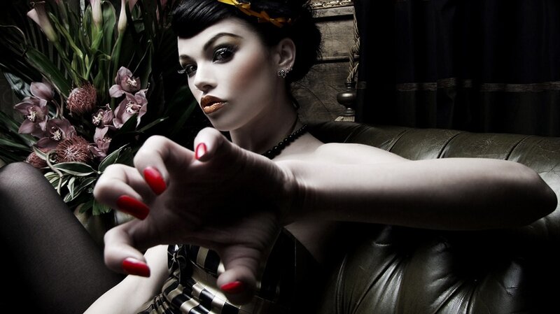 woman with red nails and flowers