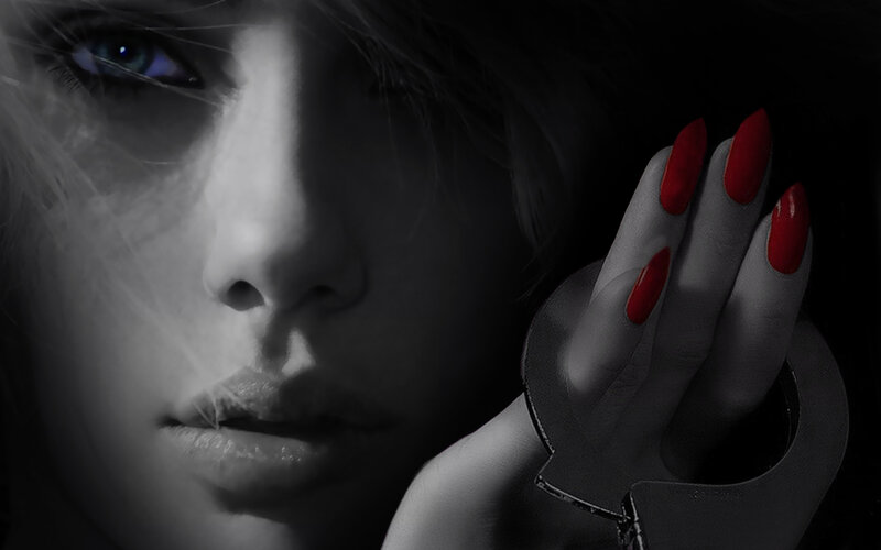 woman with red nails and handcuffs