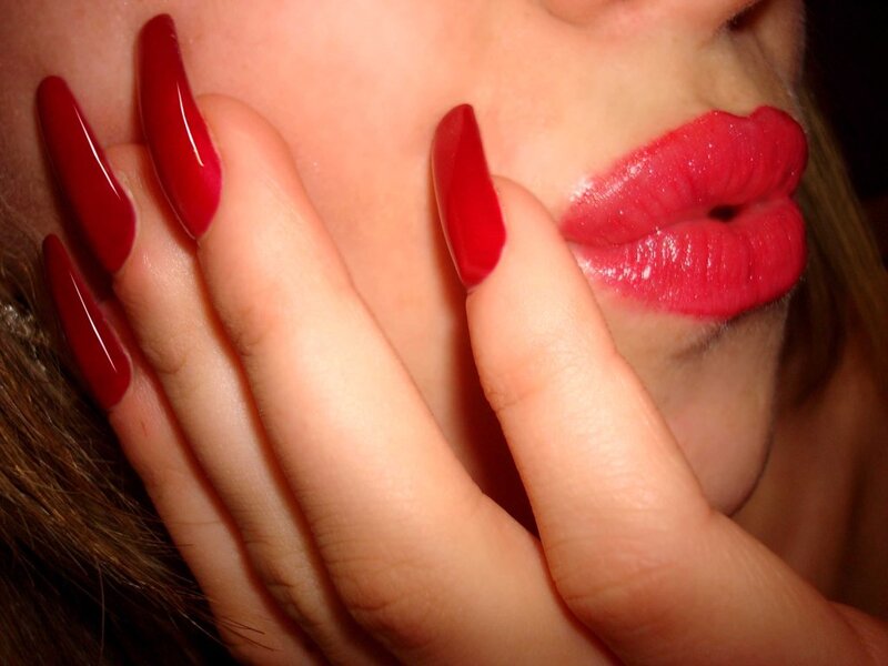 woman with red nails and lipstick