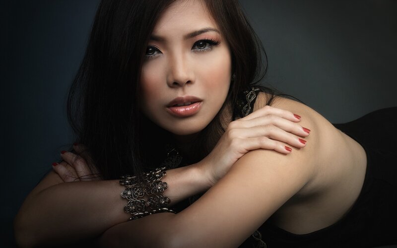 woman with red nails and makeup