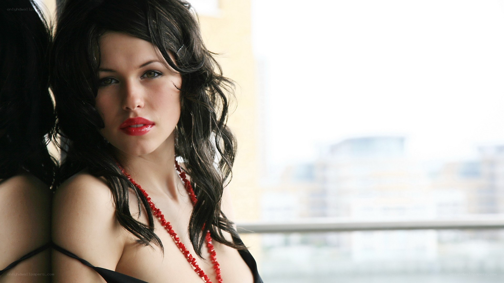 woman with red necklace