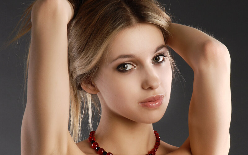 woman with red necklace