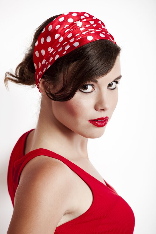 woman with red polka dot headband