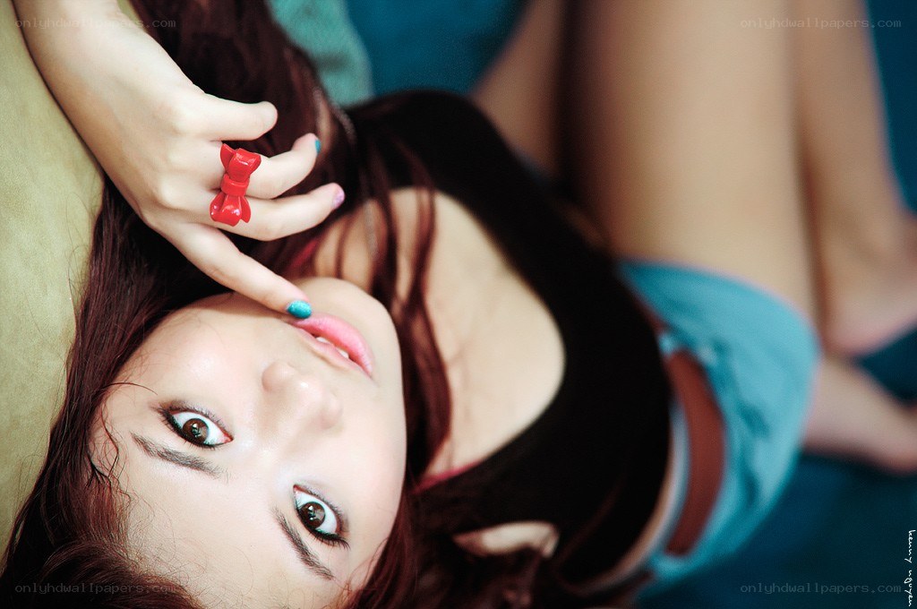 woman with red ring lying down