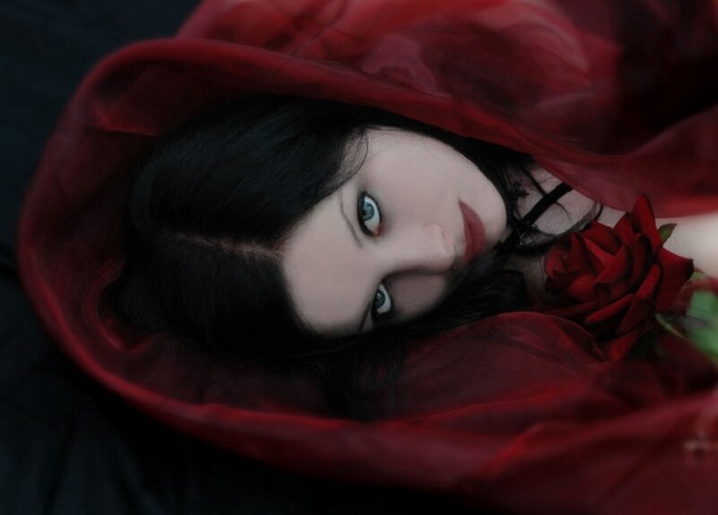 woman with red rose and veil