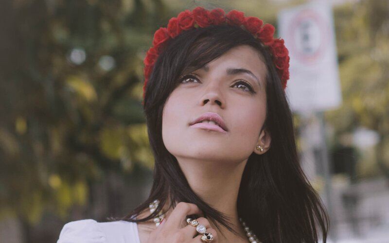 woman with red rose crown