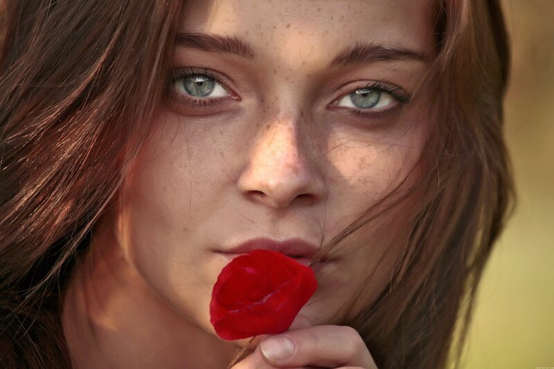 woman with red rose petal