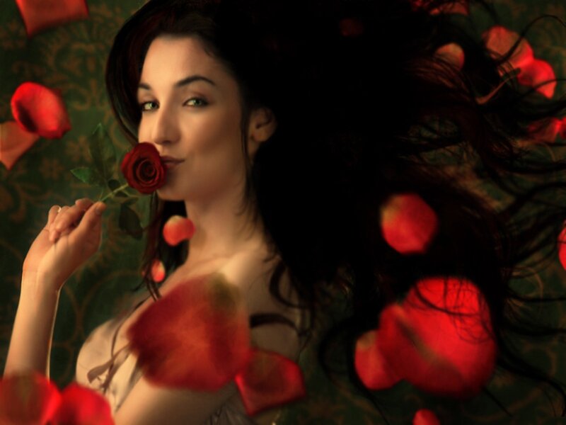 woman with red rose petals