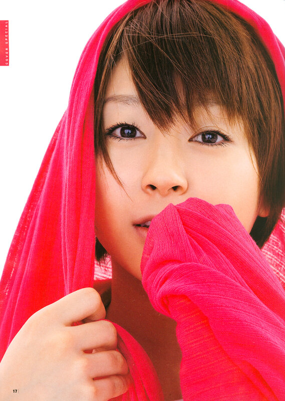 woman with red scarf covering face