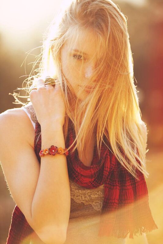 woman with red scarf in sunlight