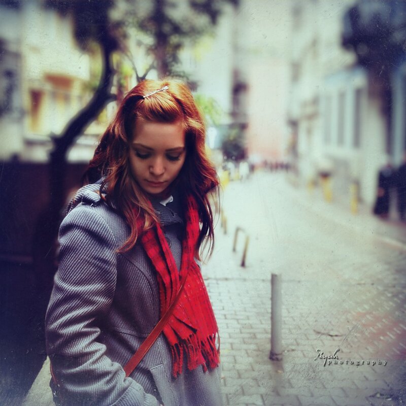 woman with red scarf on street