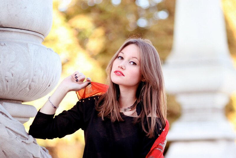 woman with red scarf outdoors