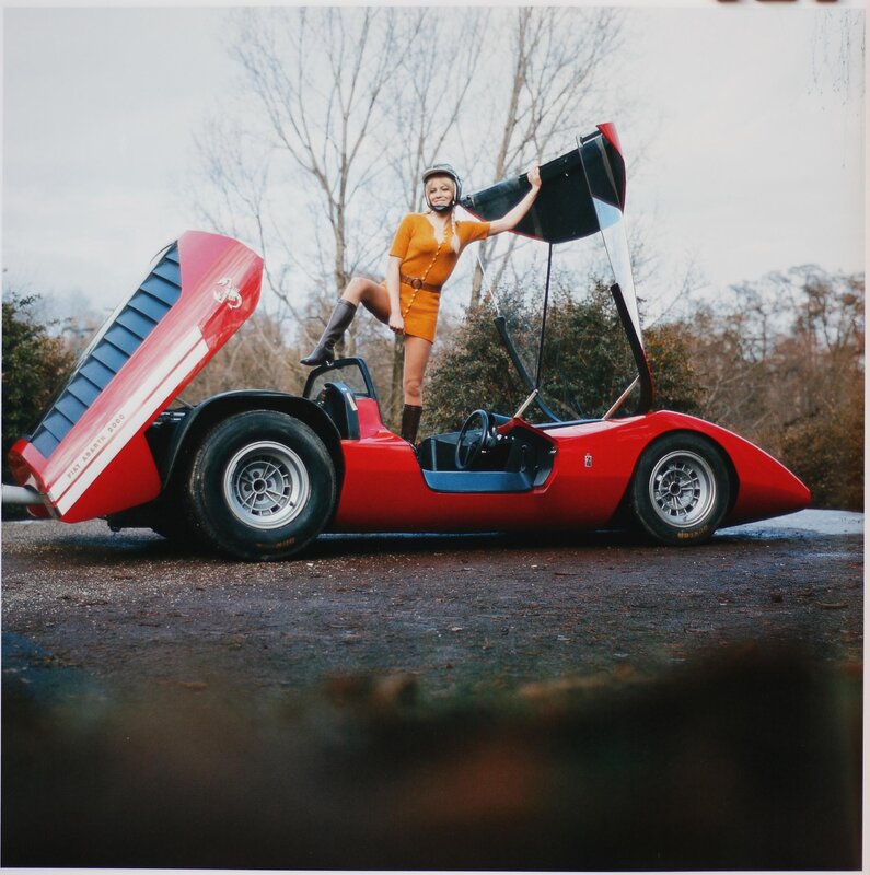 Woman with red sports car