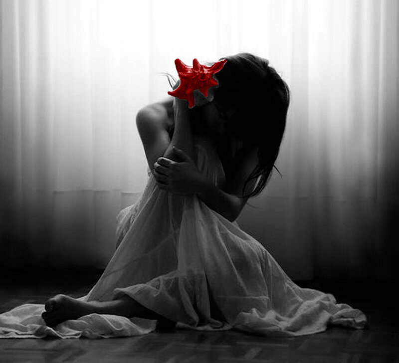 woman with red star covering face