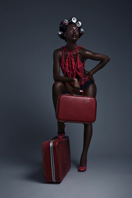 woman with red suitcases
