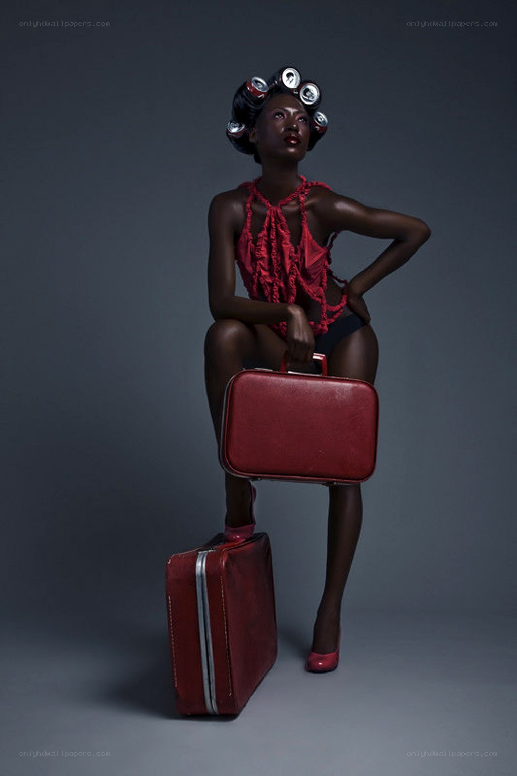 woman with red suitcases