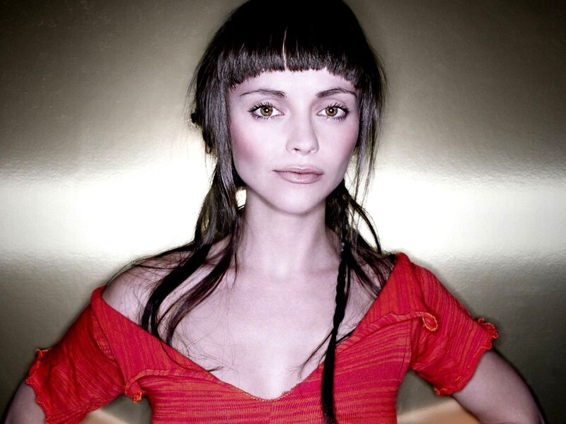 woman with red top and bangs
