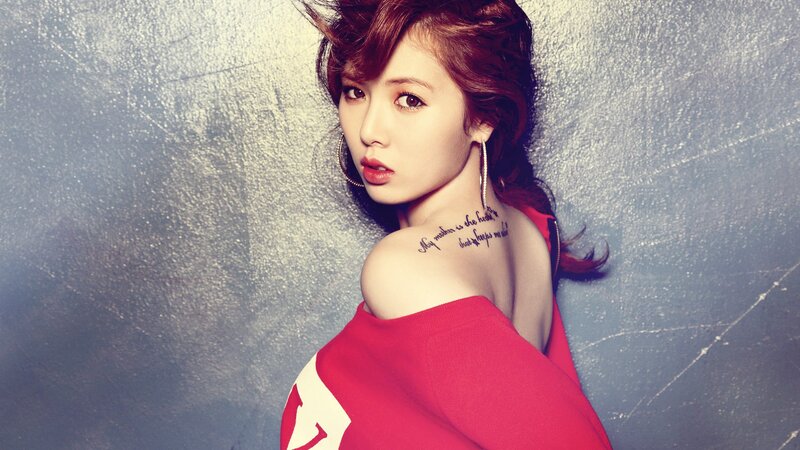 woman with red top and tattoo