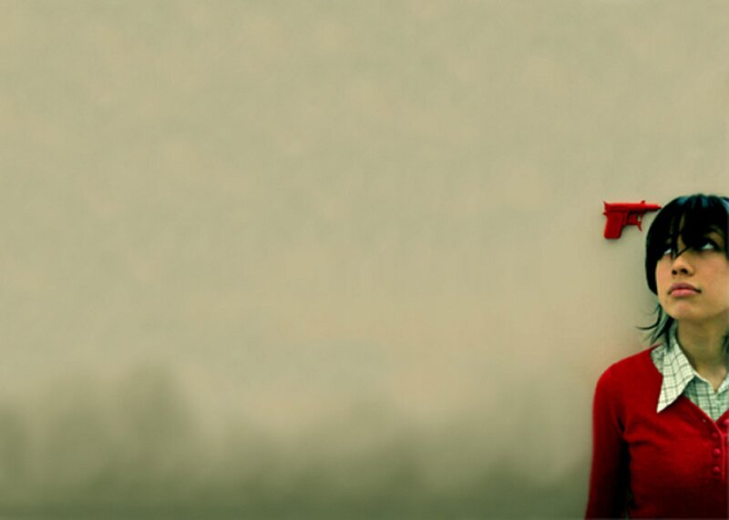 woman with red toy gun