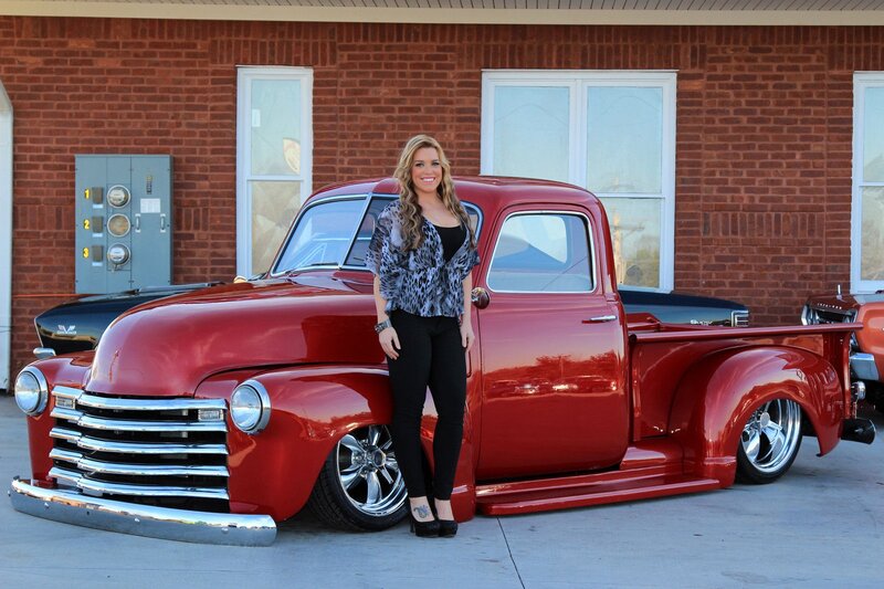 Woman with Red Truck — Confident