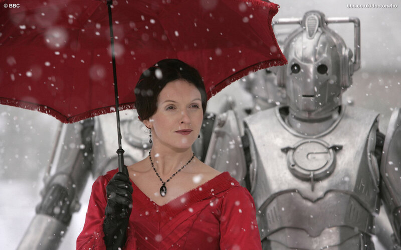 Woman with red umbrella in snow