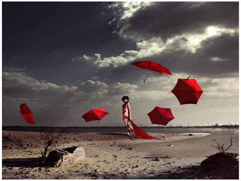 Woman with Red Umbrellas