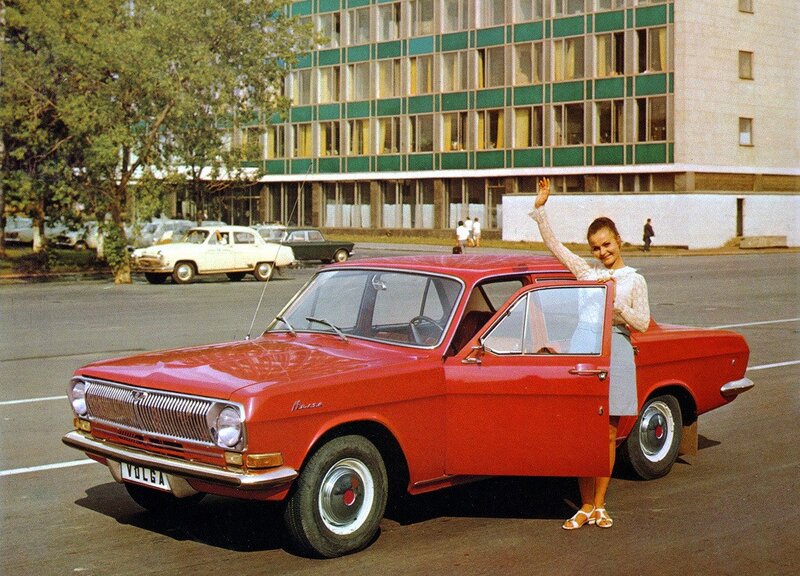 Woman with red Volga car