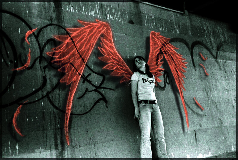 woman with red wings graffiti