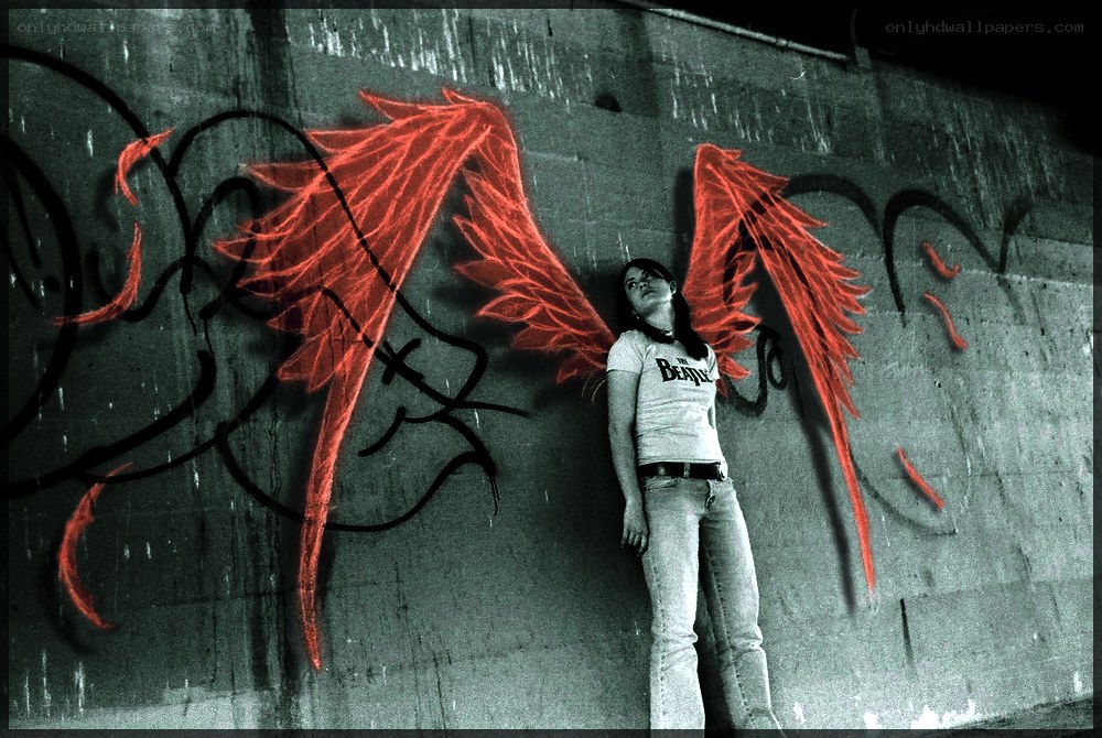 woman with red wings graffiti