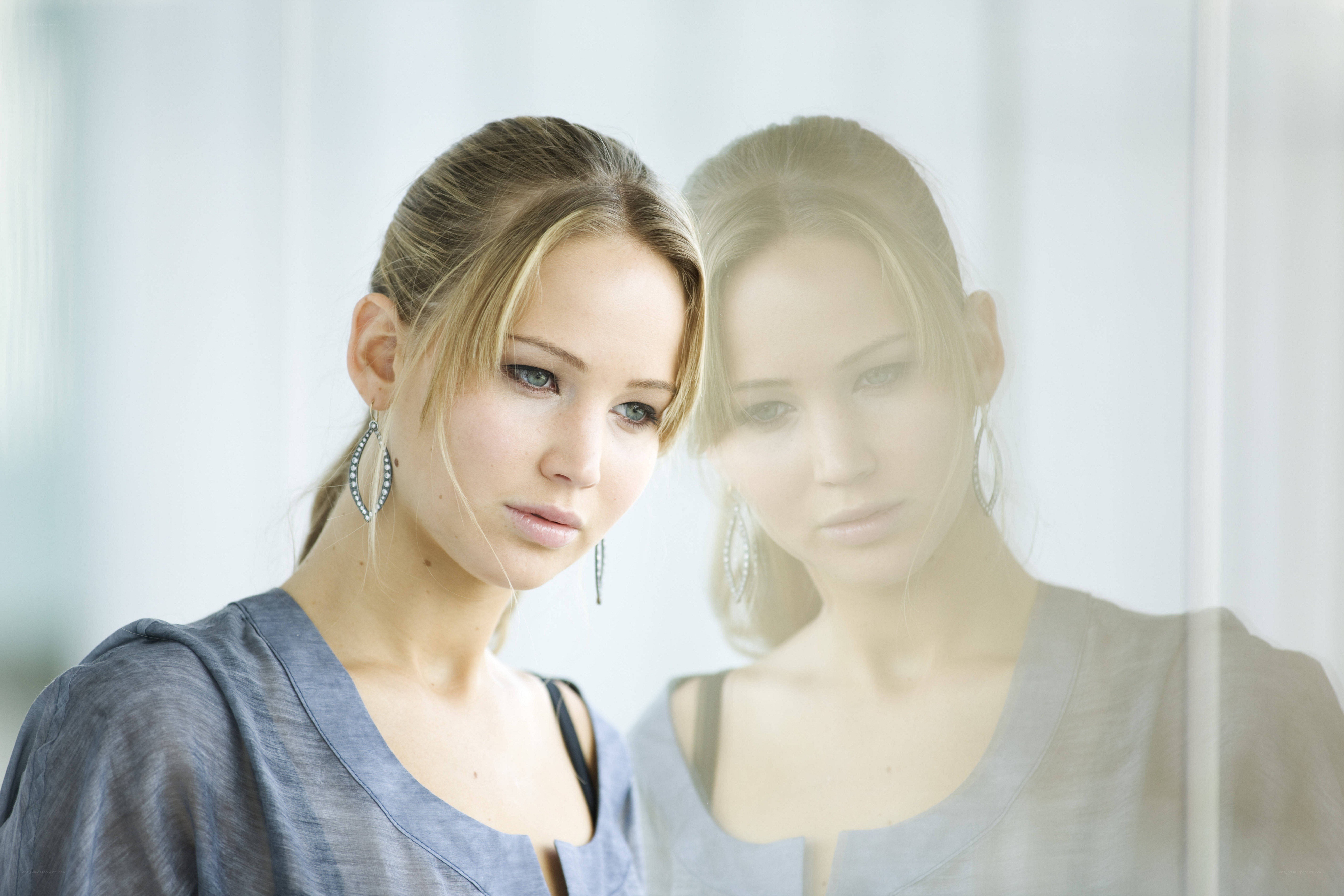 woman with reflection in glass