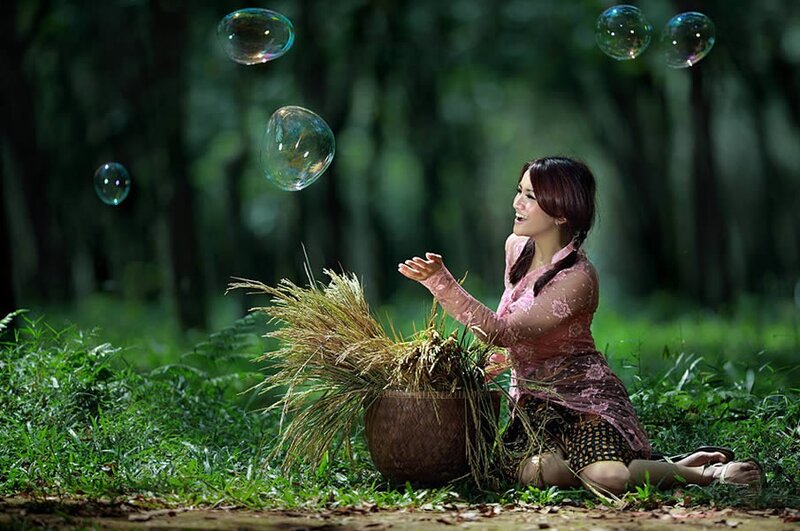 Woman with rice in forest