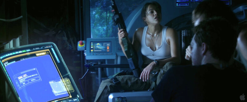 Woman with rifle in cockpit