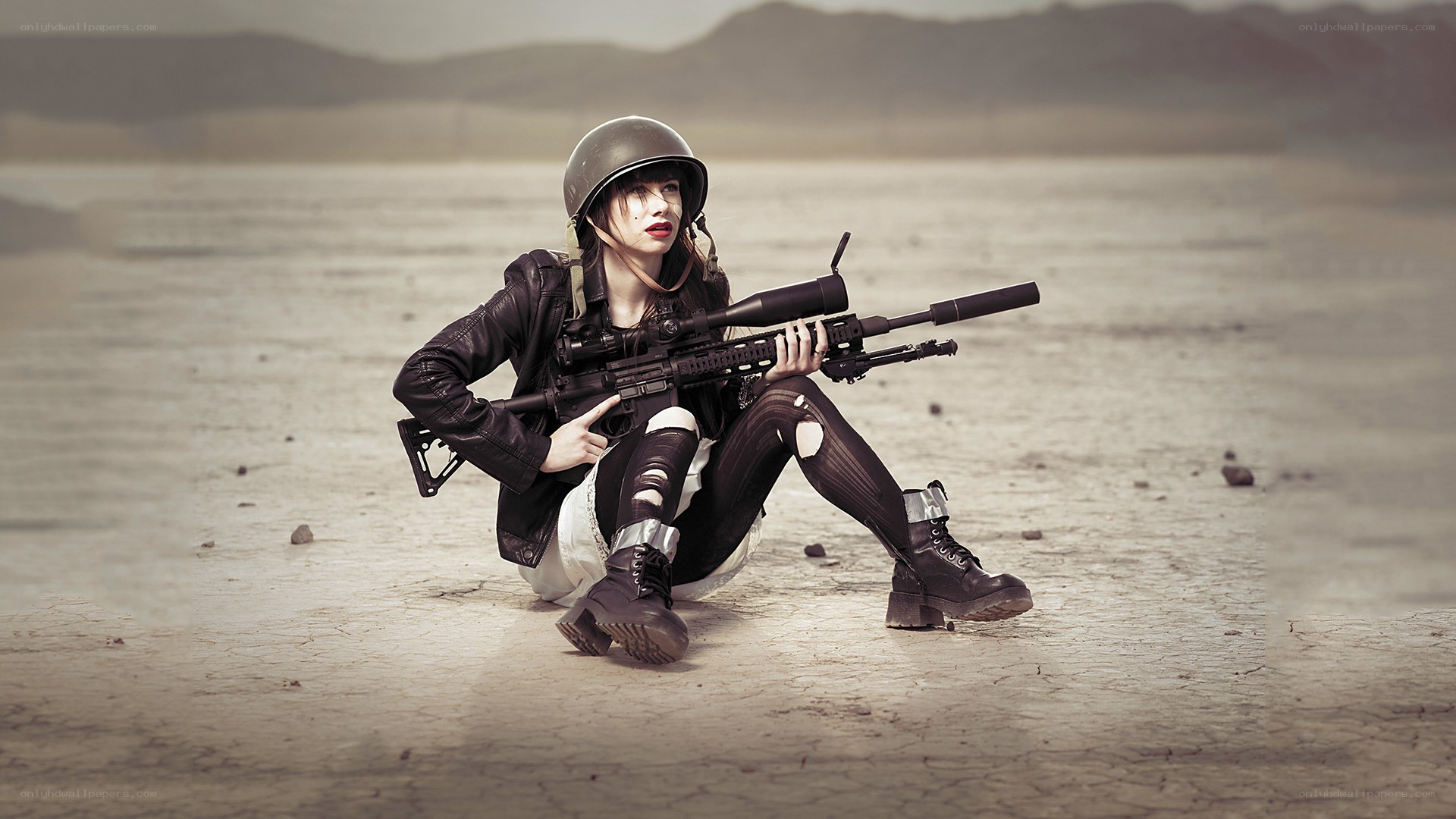 woman with rifle in desert