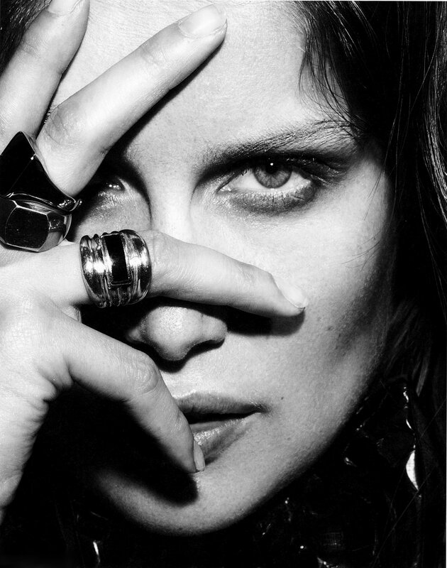 woman with rings covering face