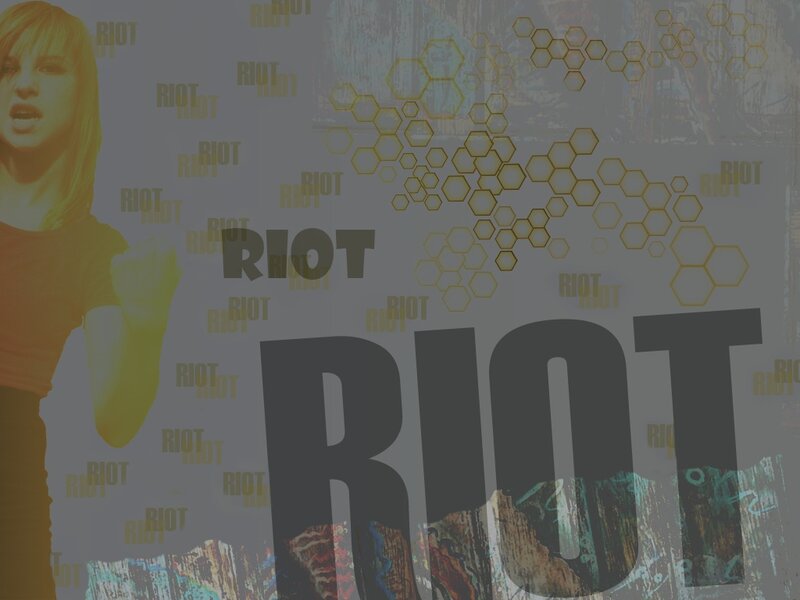 Woman with RIOT text overlay