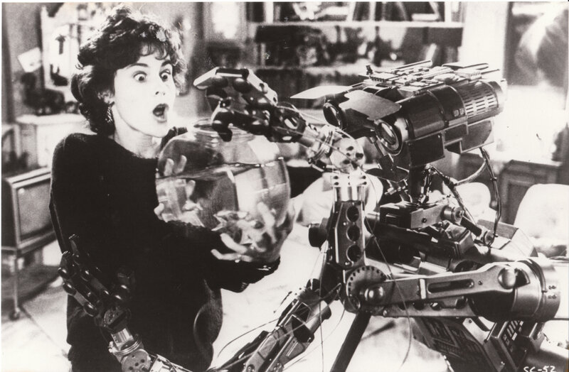 Woman with robot and fishbowl