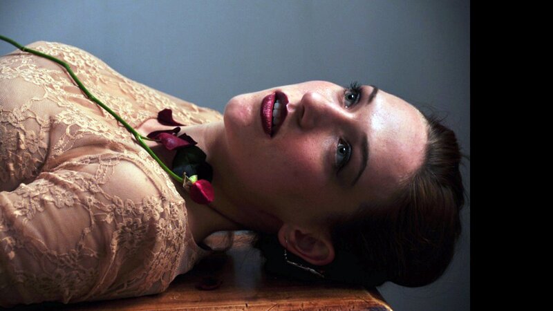 woman with rose on chest
