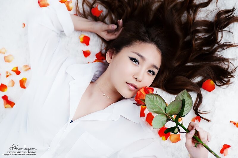 woman with rose on white background