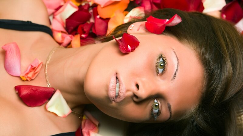 woman with rose petals