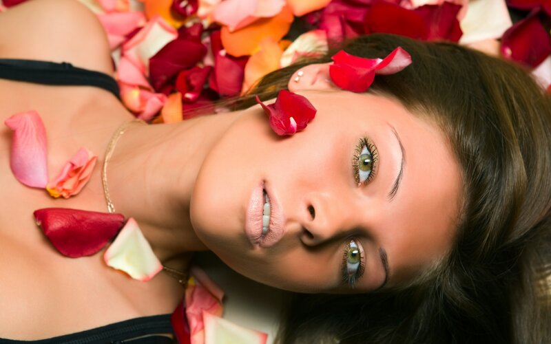 woman with rose petals