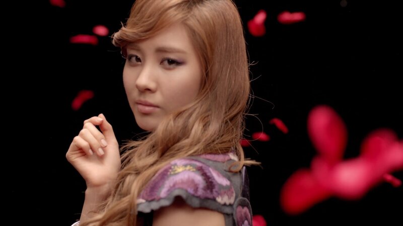woman with rose petals