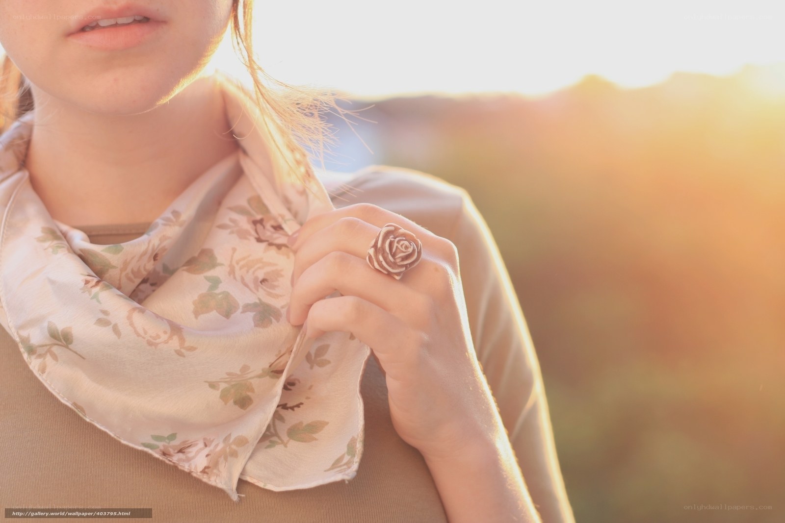 woman with rose ring at sunset
